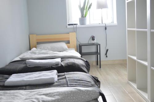 Katil atau katil-katil dalam bilik di Balaton Apartamenty