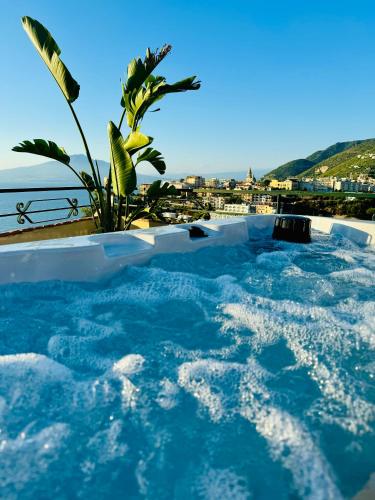 a swimming pool with a view of the ocean at Vesuvio View in Vico Equense