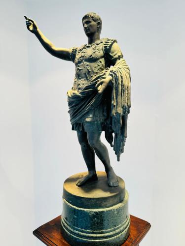 a bronze statue of a woman standing on a pedestal at Vesuvio View in Vico Equense