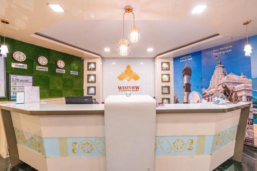 a restaurant with a reception counter in a store at Treebo Westview in Vapi