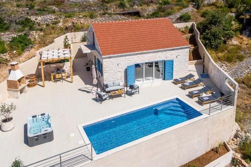 an aerial view of a house with a swimming pool at The View in Vela Luka