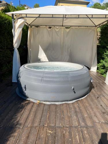 an inflatable pool in a gazebo on a deck at B&B La Soldanella in Santo Stefano dʼAveto