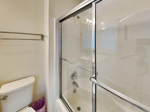 a bathroom with a shower and a toilet at Deep Creek Village #33 in McHenry