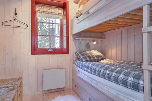 En eller flere senge i et værelse på Panorama 4 C Ski inn and out with views of Slettefjell