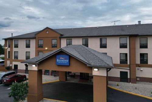 a hotel with a sign on the front of it at Baymont by Wyndham Mason in Mason