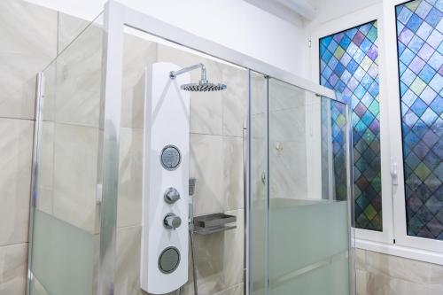 a shower with a glass door in a bathroom at MH Luxury Suite Pantheon in Rome