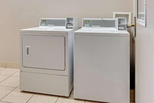 two white refrigerators sitting next to each other in a room at Country Inn & Suites by Radisson, Grand Rapids Airport, MI in Grand Rapids