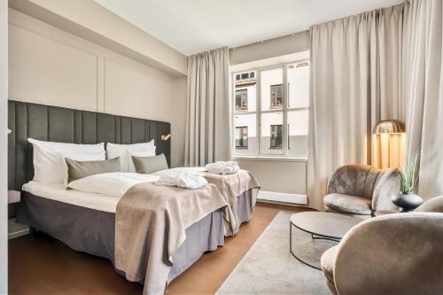 Postel nebo postele na pokoji v ubytování Home Hotel Bryggen