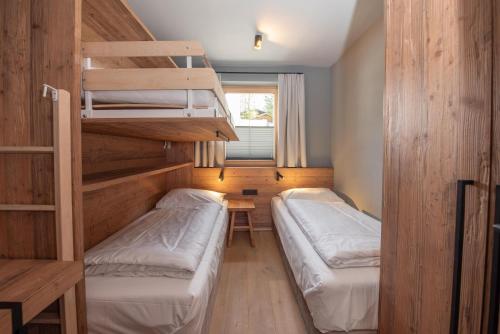 Ένα ή περισσότερα κρεβάτια σε δωμάτιο στο Filzsteinresort Wohnungen Top 8