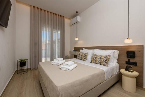 Postel nebo postele na pokoji v ubytování Earth Boutique Apartment