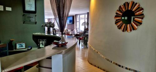 a bar in a restaurant with a mirror on the wall at Crystal Lagoon Lodge in Langebaan