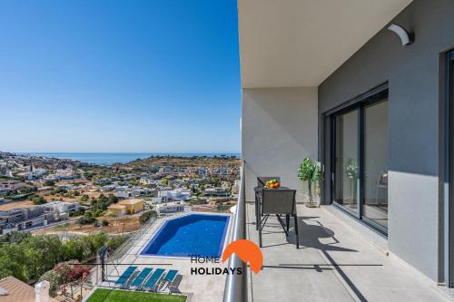 a view from the balcony of a house with a swimming pool at #233 Fox Trail by Home Holidays in Páteo