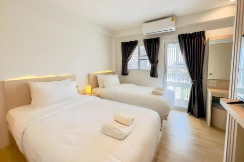 Ένα ή περισσότερα κρεβάτια σε δωμάτιο στο Zhennan Teabar Hotel