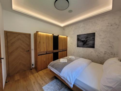 Postel nebo postele na pokoji v ubytování 1 CHALET SPA & WELLNESS - Jasná Center