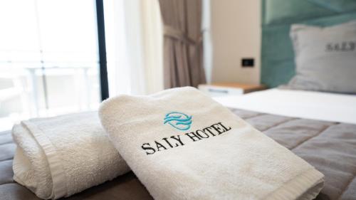 Postel nebo postele na pokoji v ubytování Hotel Saly