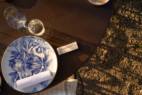 a blue and white plate on a table at La Darbia in Ameno