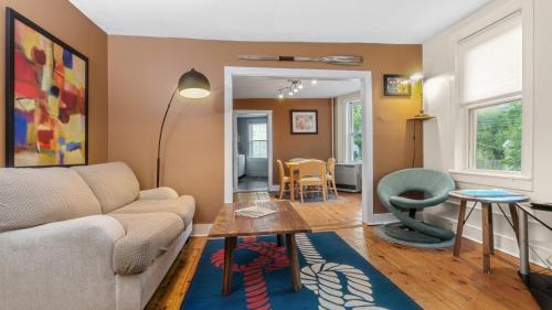 a living room with a couch and a table at East end. Walk to food, beer and downtown fun. in Portland