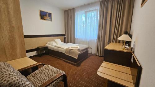 Postel nebo postele na pokoji v ubytování Hotel Adler