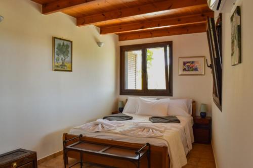 Postel nebo postele na pokoji v ubytování Mylonakis Home