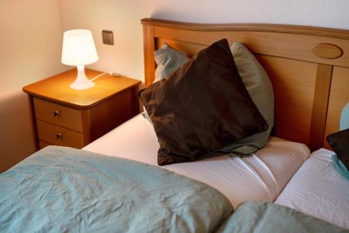 a bedroom with a bed with a pillow on it at Fewo Naturliebe - keine Monteure in Dornhan