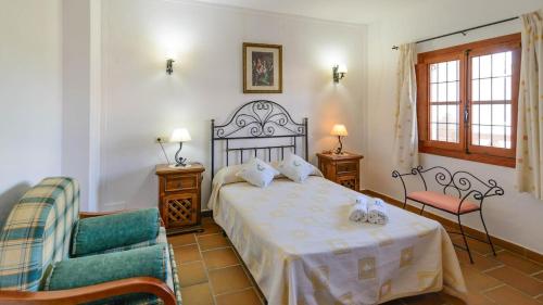 Posteľ alebo postele v izbe v ubytovaní Cortijo Los Tulipanes Periana by Ruralidays