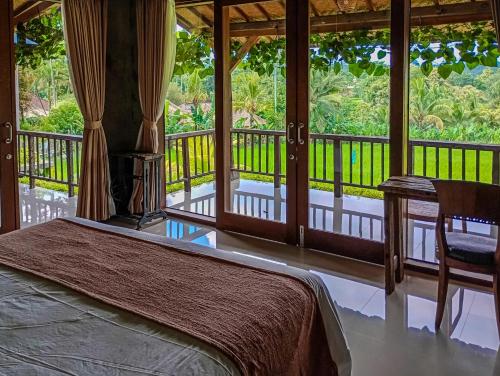 Balkón nebo terasa v ubytování Dukuh Ubud Villa
