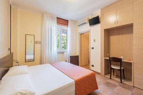 Postel nebo postele na pokoji v ubytování Hotel Gabrini