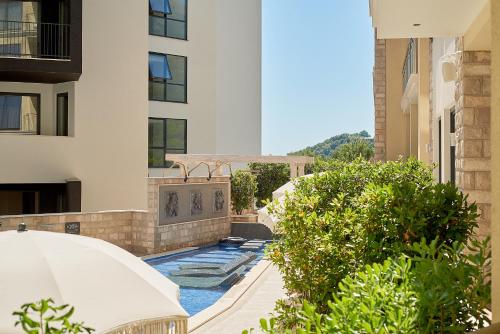 a swimming pool in the middle of a building at BigMontenegro Dreams in Becici