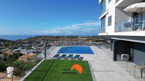 a view of a building with a swimming pool at #234 Serenity Refuge w Balcony and Pool in Páteo