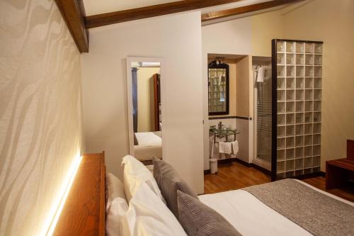 Postel nebo postele na pokoji v ubytování Hotel El Doncel