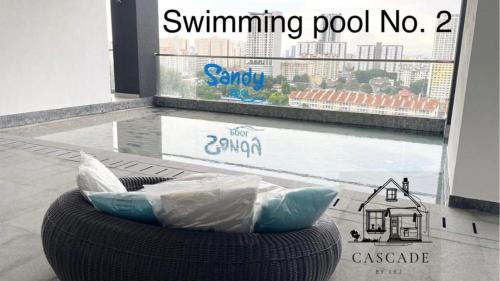 a chair with pillows sitting in front of a window at 22 Urban Suites #Georgetown #NEW #TopFacilities in Jelutong
