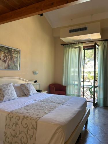 Postel nebo postele na pokoji v ubytování Hotel Duca Della Corgna