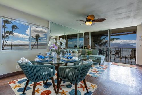 a living room with a table and chairs at Maalaea Kai 220 in Wailuku