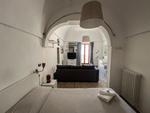 Ένα ή περισσότερα κρεβάτια σε δωμάτιο στο Casetta Lara