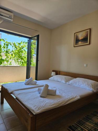 a bedroom with a bed with two towels on it at Apartment Lavanda in Starigrad