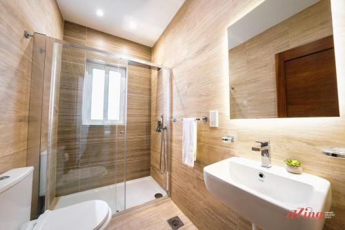 a bathroom with a toilet and a sink and a shower at Beautiful Holiday Home with Private Rooftop Pool in Mellieħa