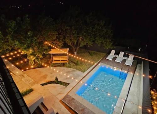 an overhead view of a swimming pool at night at Bjni Mer Dacha in Bjni