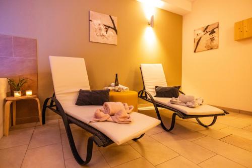 two chairs with towels on them in a room at Haus Freunden in Sankt Anton am Arlberg