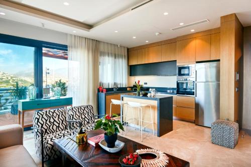a kitchen and living room with a couch and a table at Root Redrock Yalıkavak in Yalıkavak