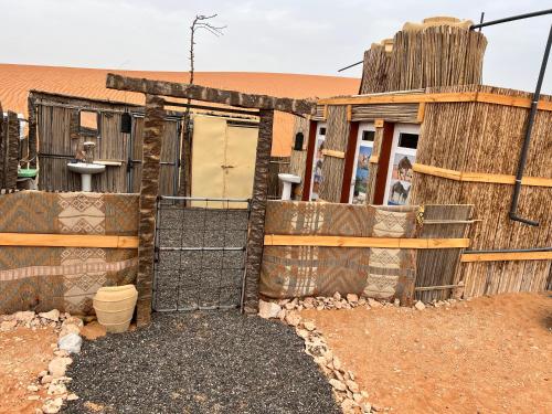a building in the middle of the desert at Desert Private Camp - Bedouin Camp in Al Wāşil