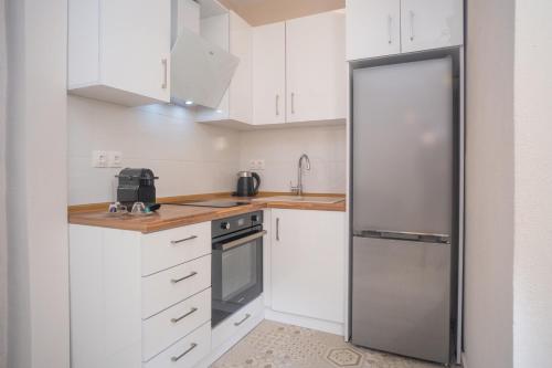 Kuchyň nebo kuchyňský kout v ubytování Cozy Home