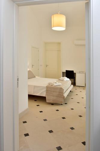 Postel nebo postele na pokoji v ubytování Adhoc Rooms