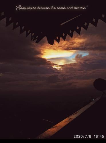a view of the sunset from an airplane at White Sea Homestay in Kurseong
