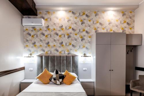 Кровать или кровати в номере La Strada Boutique Villa