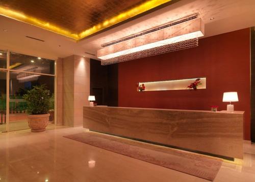 a lobby with a reception desk in a building at Hotel Royal Orchid Jaipur, Tonk Road in Jaipur