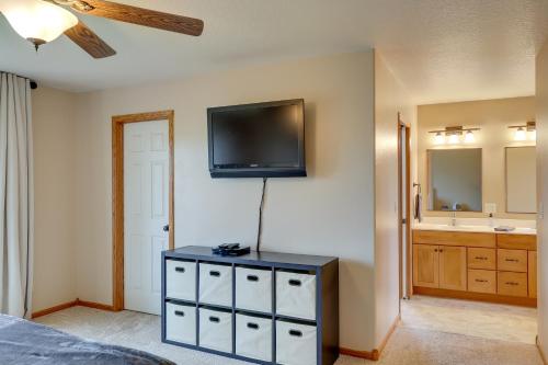 a bedroom with a flat screen tv on the wall at Roomy Piedmont Home with Yard Less Than 14 Mi to Sturgis! in Piedmont