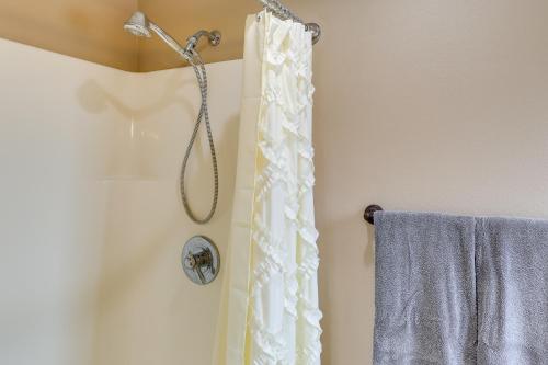 a shower with a white shower curtain in a bathroom at Roomy Piedmont Home with Yard Less Than 14 Mi to Sturgis! in Piedmont