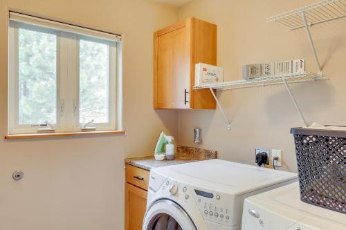 a laundry room with a washing machine and a window at Roomy Piedmont Home with Yard Less Than 14 Mi to Sturgis! in Piedmont