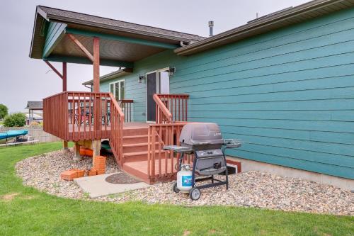 a barbecue grill sitting next to a house at Roomy Piedmont Home with Yard Less Than 14 Mi to Sturgis! in Piedmont