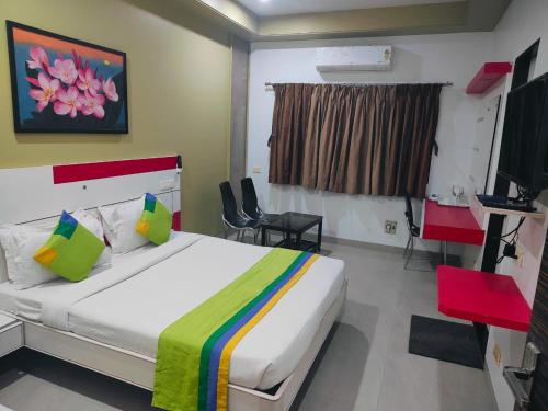 Ένα ή περισσότερα κρεβάτια σε δωμάτιο στο Hotel Bagga International